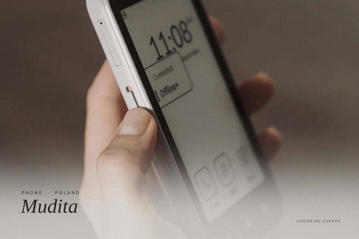 A hand holding a Mudita phone